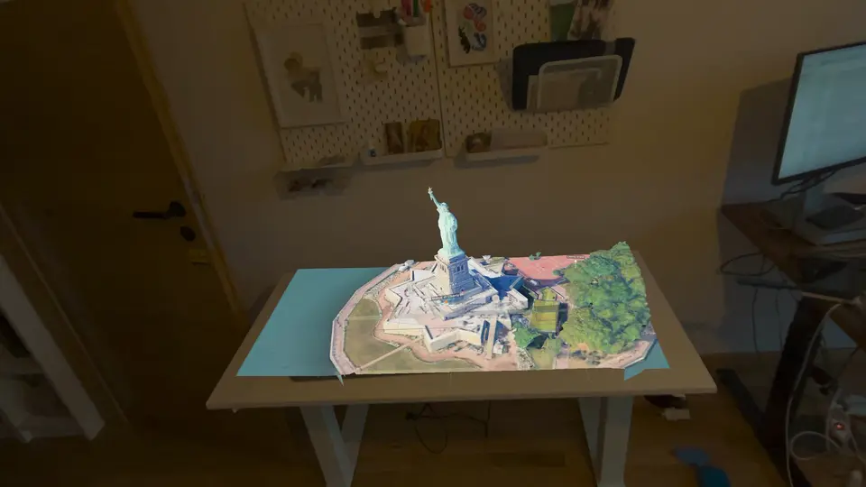 The Statue of Liberty on Liberty Island, on a desk